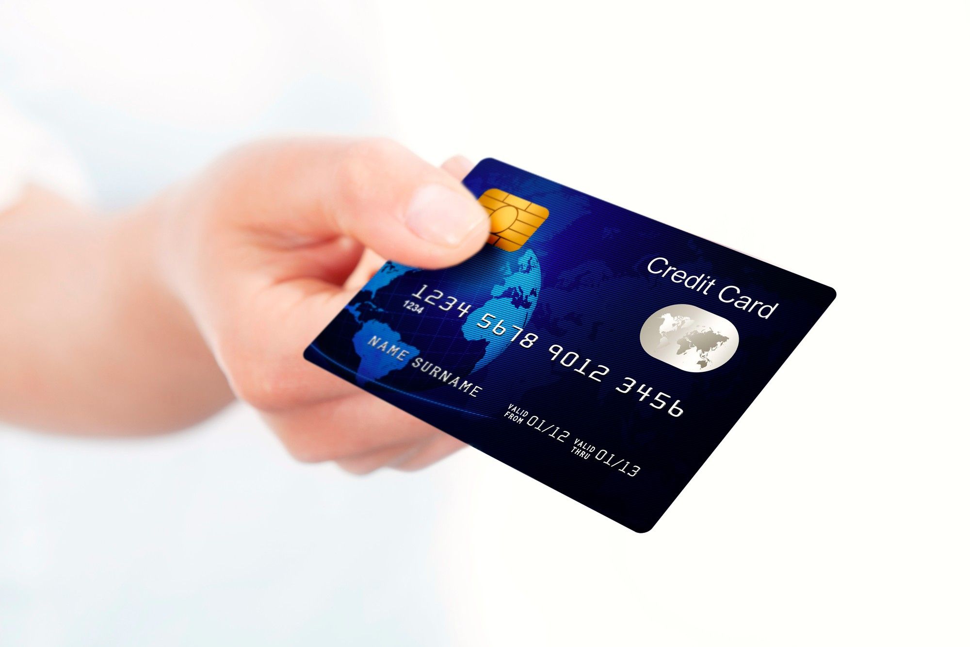 Blue credit card held by hand
