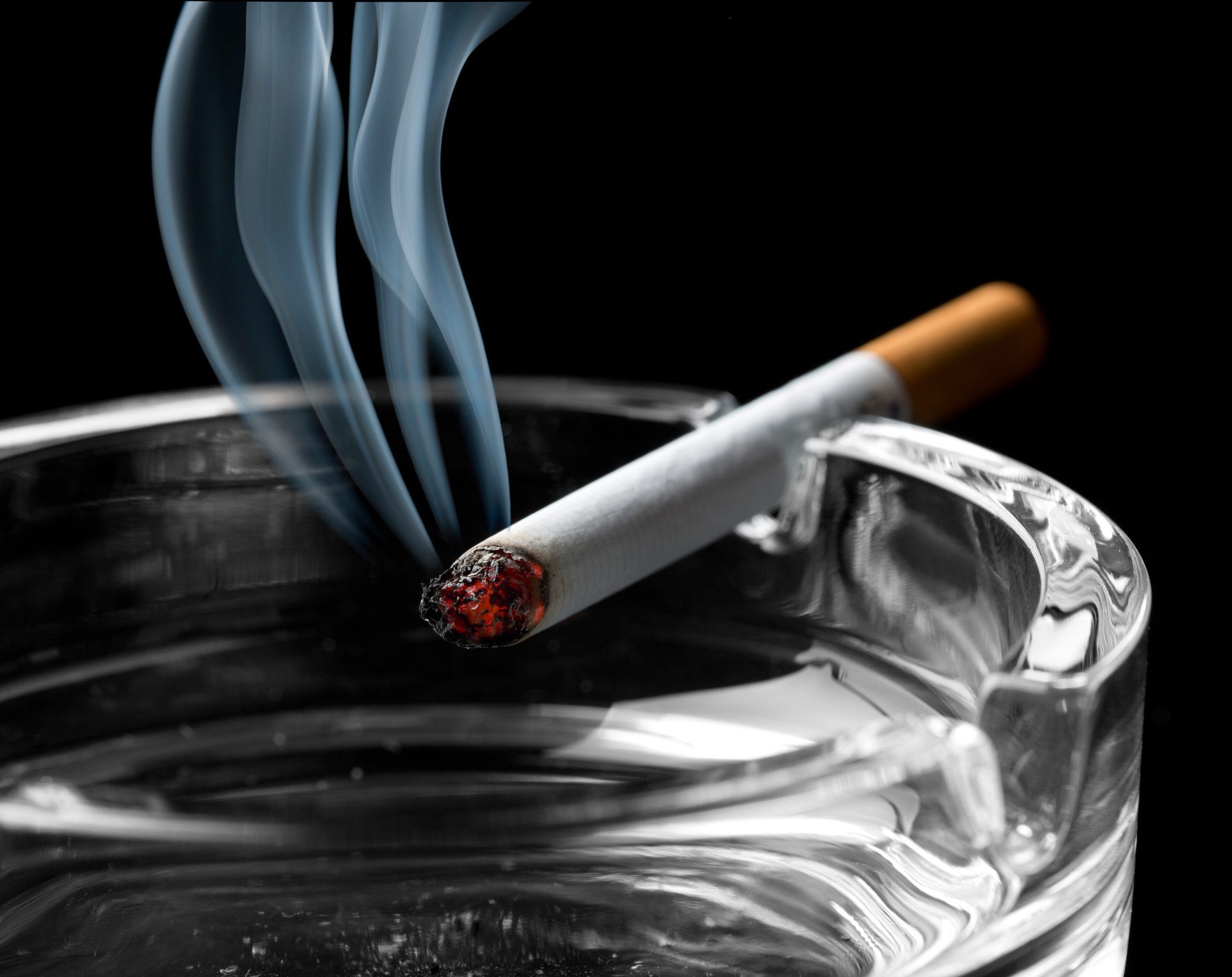 smoking cigarette in ashtray