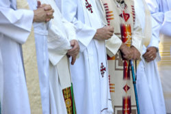 Priests with folded hands