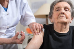 Elderly woman who filed one of numerous Zostavax lawsuits gets a vaccine.