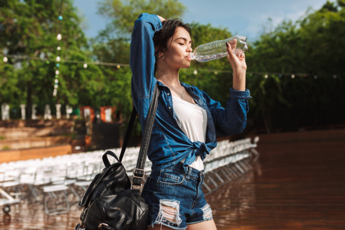 woman drinking Peñafiel Mineral Spring Water