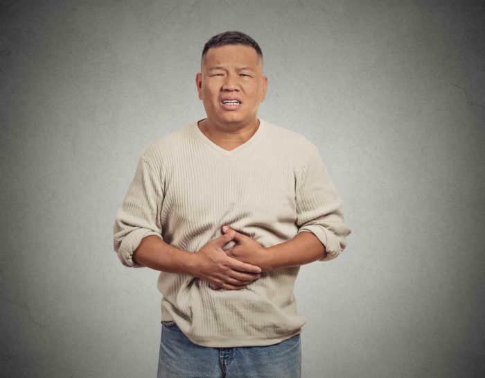 Asian man stomach pain