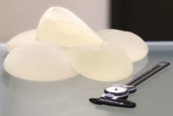 Close up of breast implants and calipers