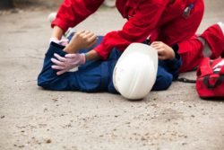 Construction worker lying on ground