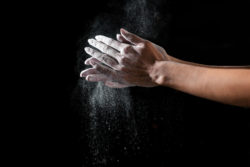 Rubbing talcum powder into hands