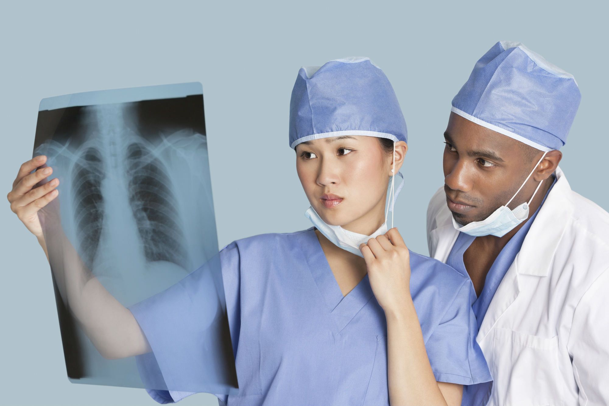 Surgeons looking at chest x-ray