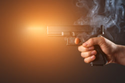 Smoking Glock handgun fires bullet
