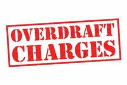 red rubber stamp with overdraft charges