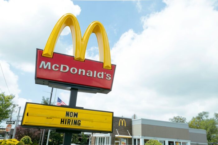 A sign for McDonalds showing that they are hiring