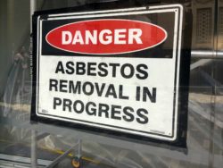 Sign reads: Danger - Asbestos removal in progress