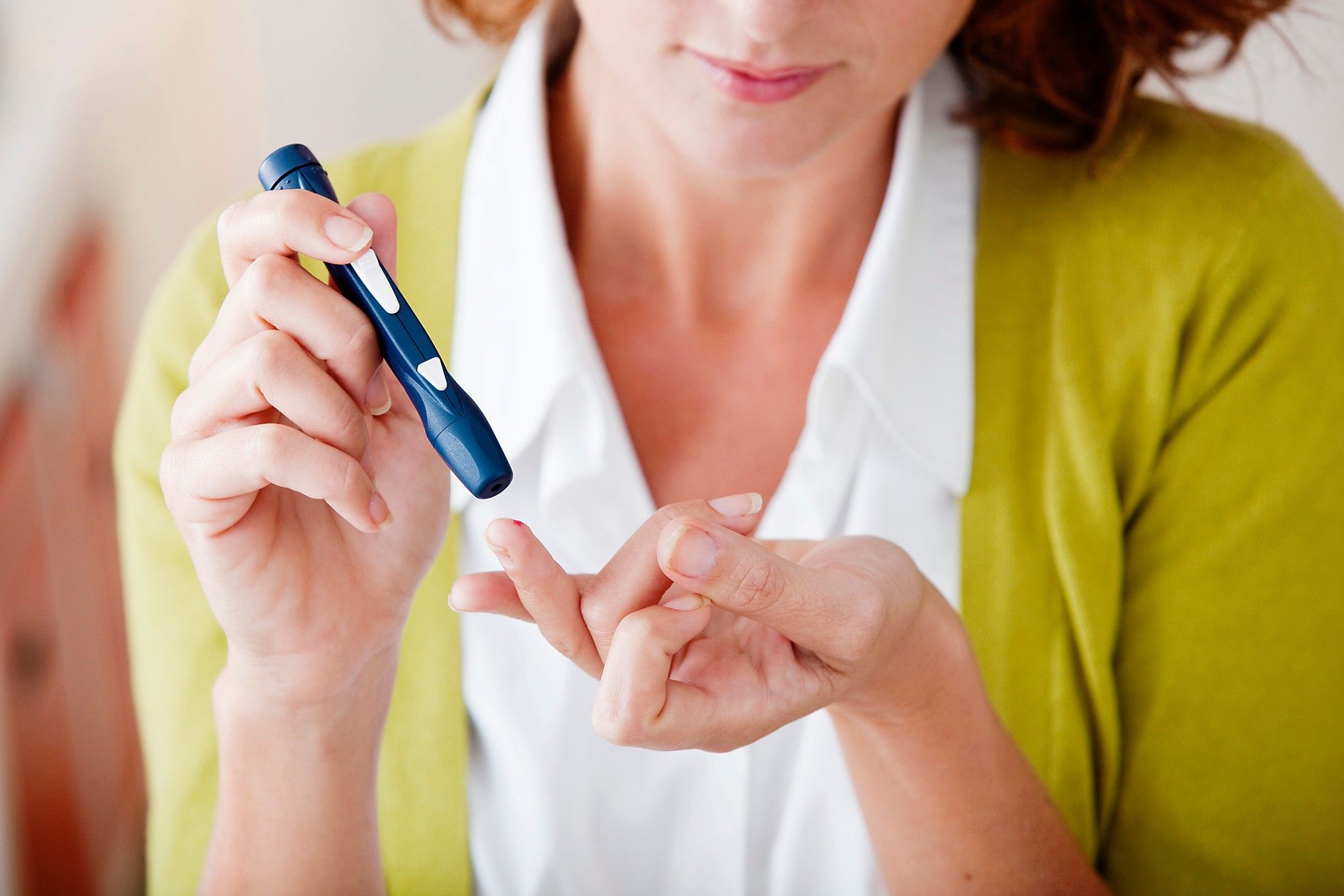woman testing insulin for diabetes