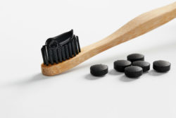 Black toothpaste with charcoal pills