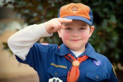 cub scout giving salute