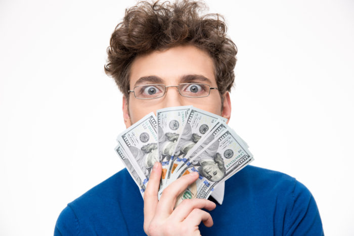 man holding settlement money cash