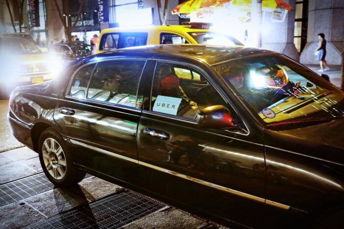 Uber car service on the streets at night
