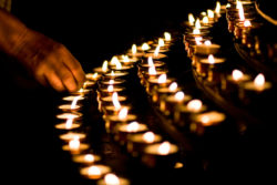 Lighting votive candles