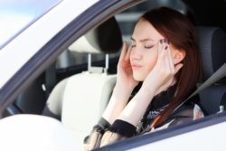woman with headache after a car accident