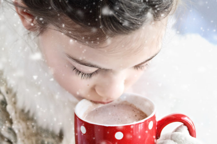 child drinking swiss miss hot cocoa