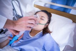 teen in hospital bed with lung illness