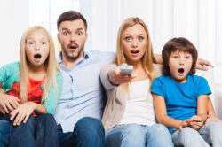 A family watches TV.