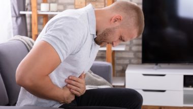 man suffering from stomach pain or heartburn