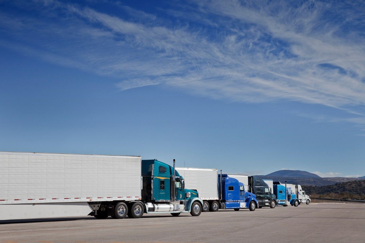 semi trucks and drivers at rest stop