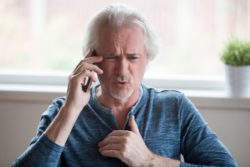 man on cell phone, annoyed at caller