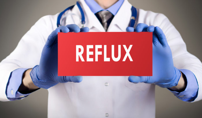 doctor holding reflux sign regarding zantac