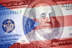 flag of Puerto Rico on a US hundred dollar bill