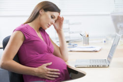 pregnant woman stressed at work