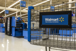 Walmart shopping cart in front of checkout