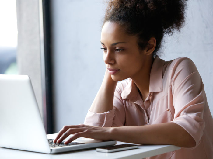 woman working on ASUS laptop