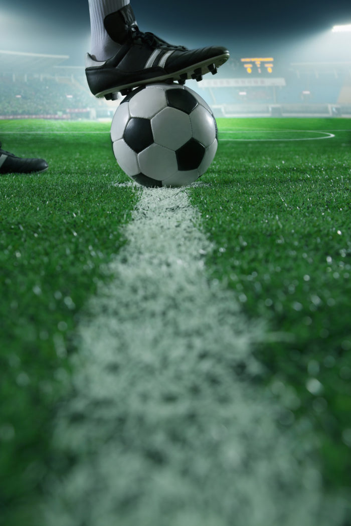 u.s. women's soccer team player's foot on soccer ball