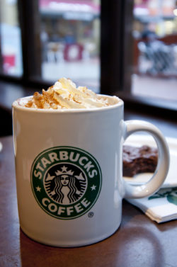 Starbucks mug with hot chocolate and whipped cream