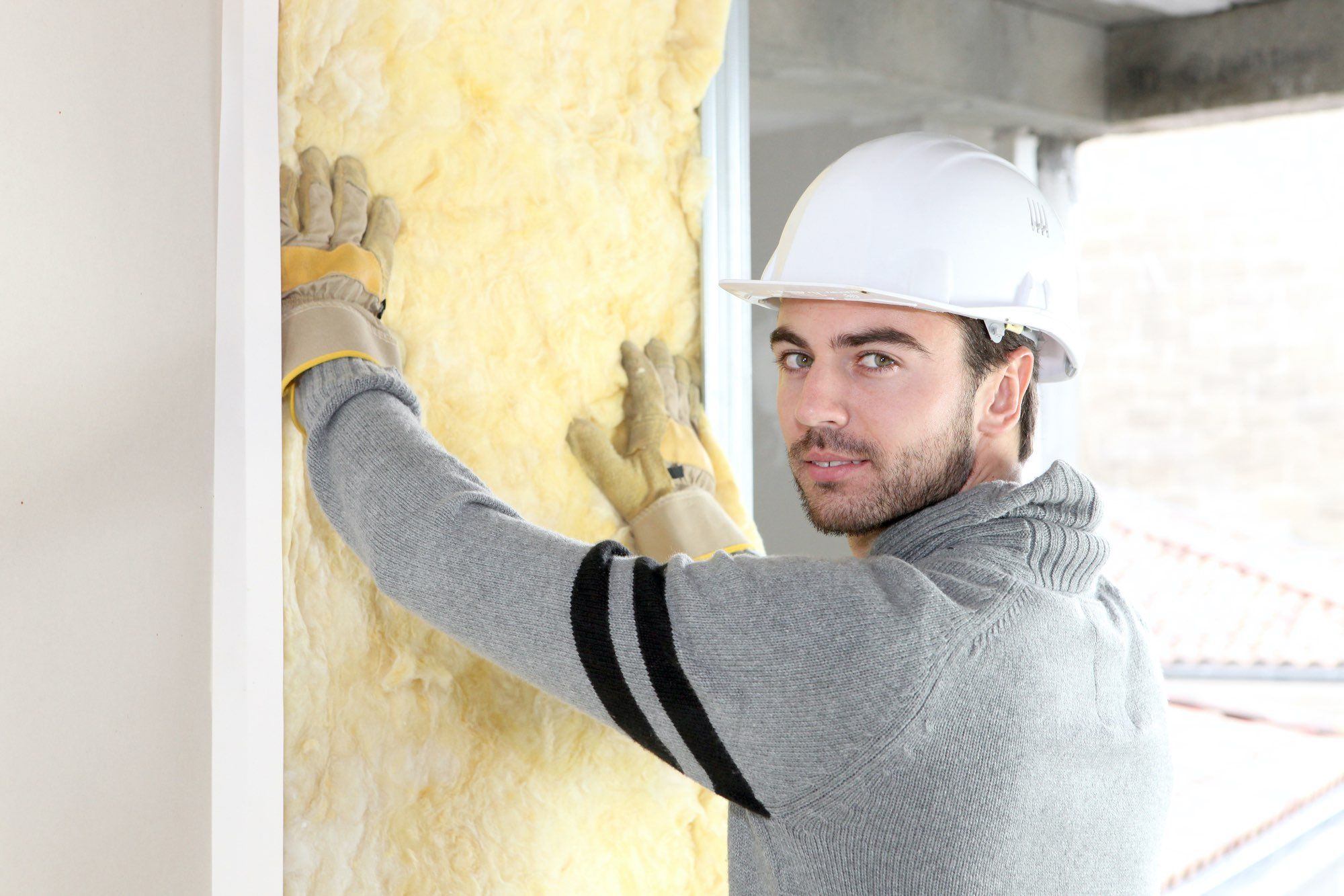 Man installs insulation