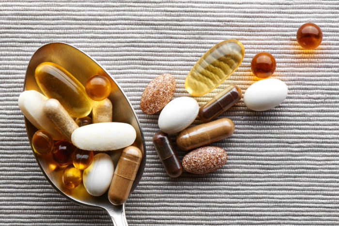 Supplement pills in tablespoon