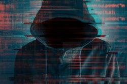 computer hacker in hoodie
