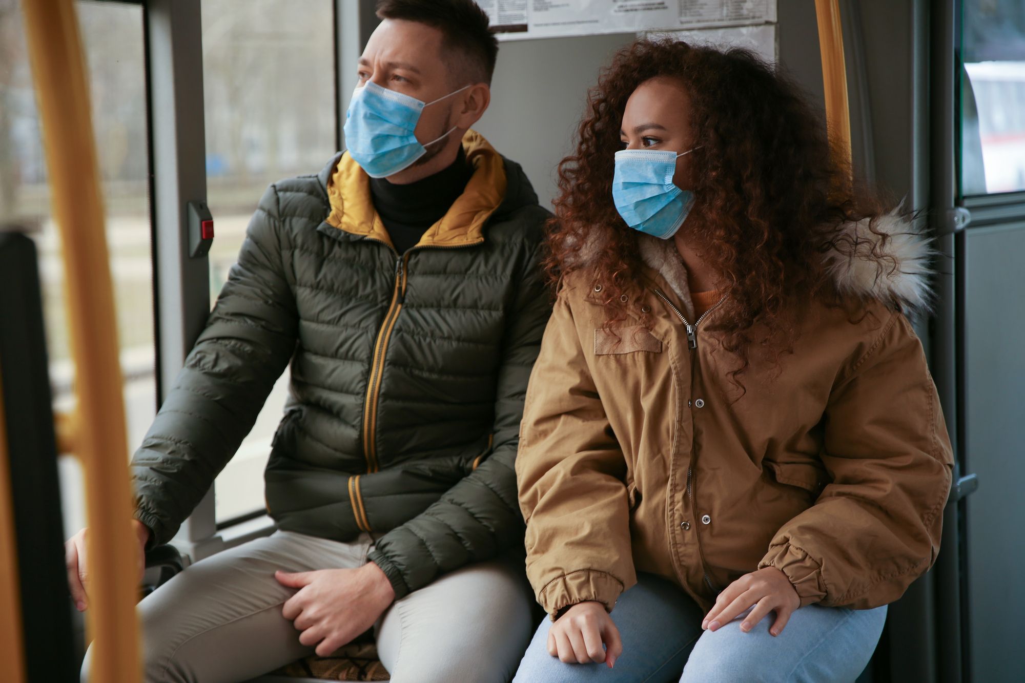 couple wearing masks due to the coronavirus outbreak