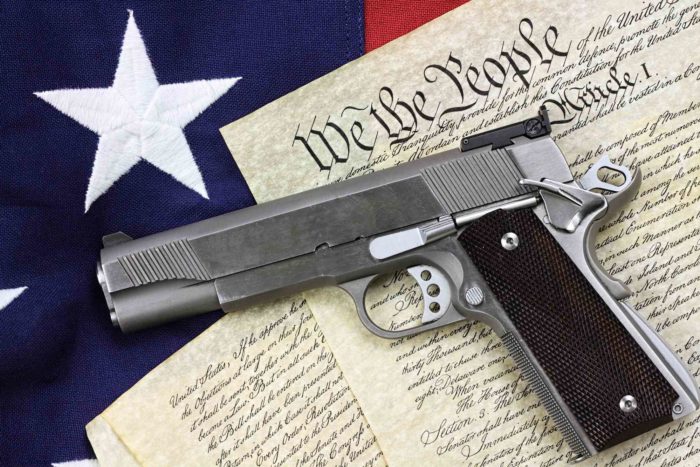 an NRA gun on top of the constitution