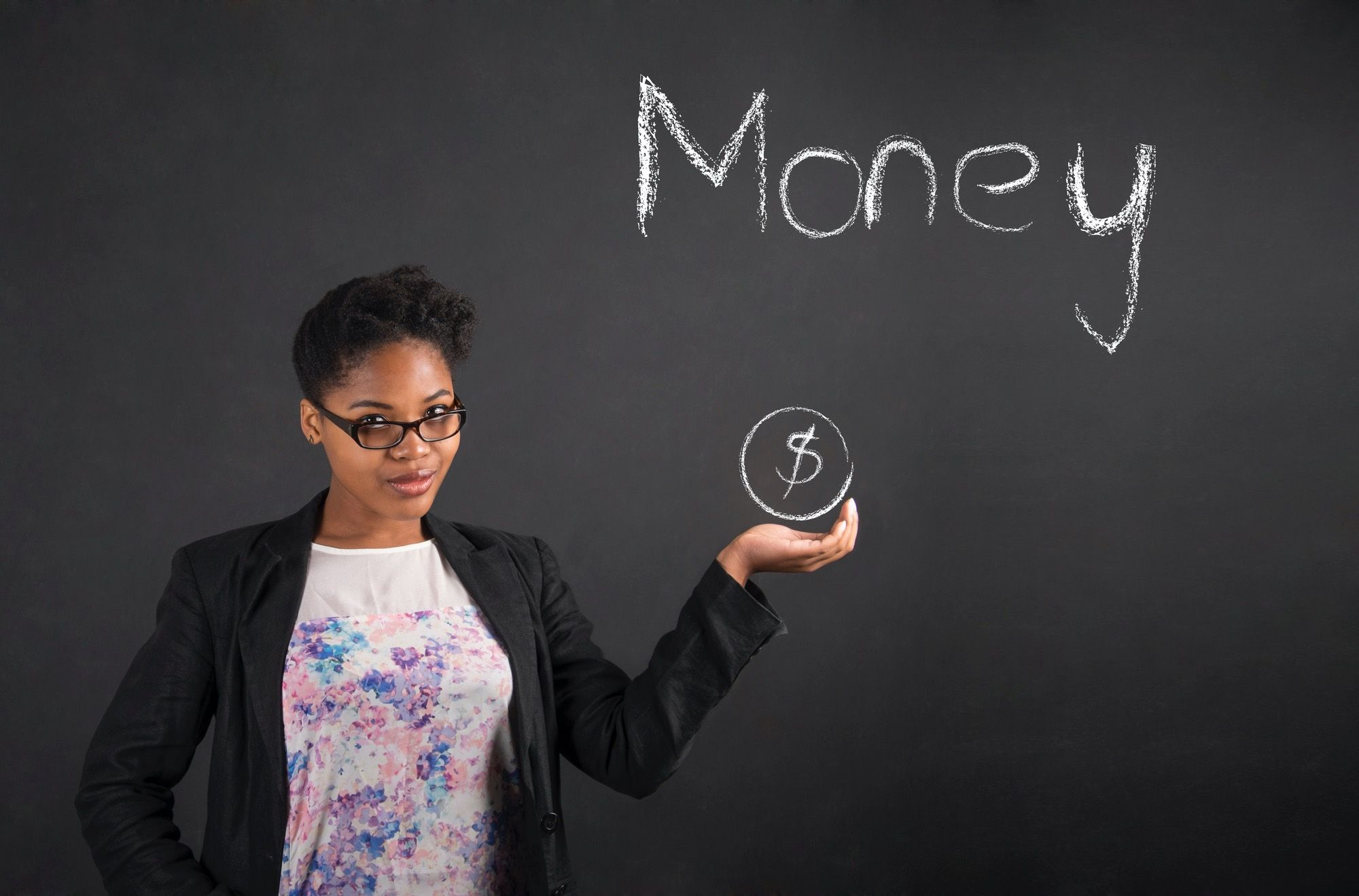 Woman in front of chalkboard with dollar sign symbol and the word money