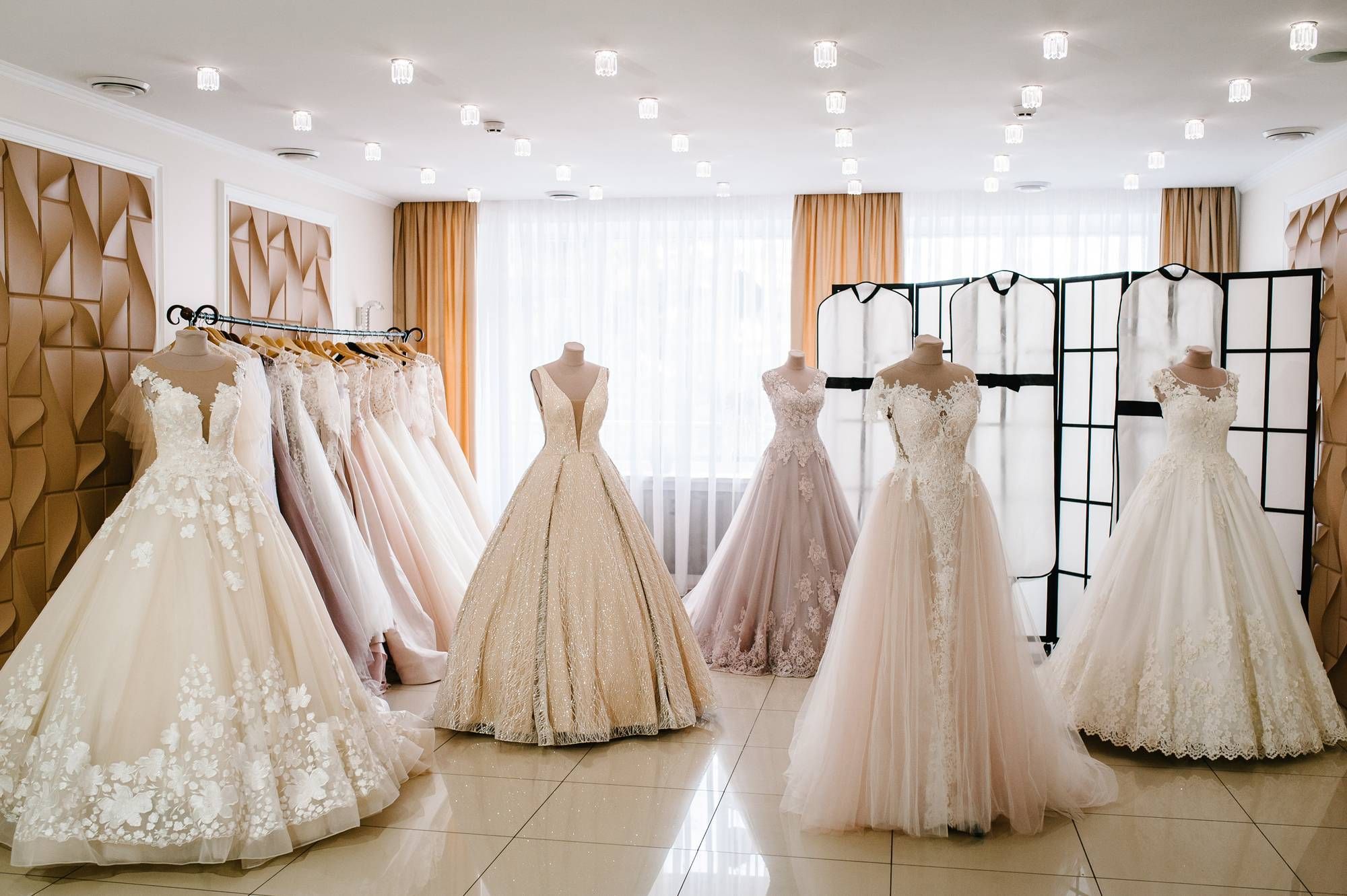 a bridal shop with wedding dresses on display