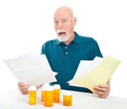Senior male overwhelmed by medical bills