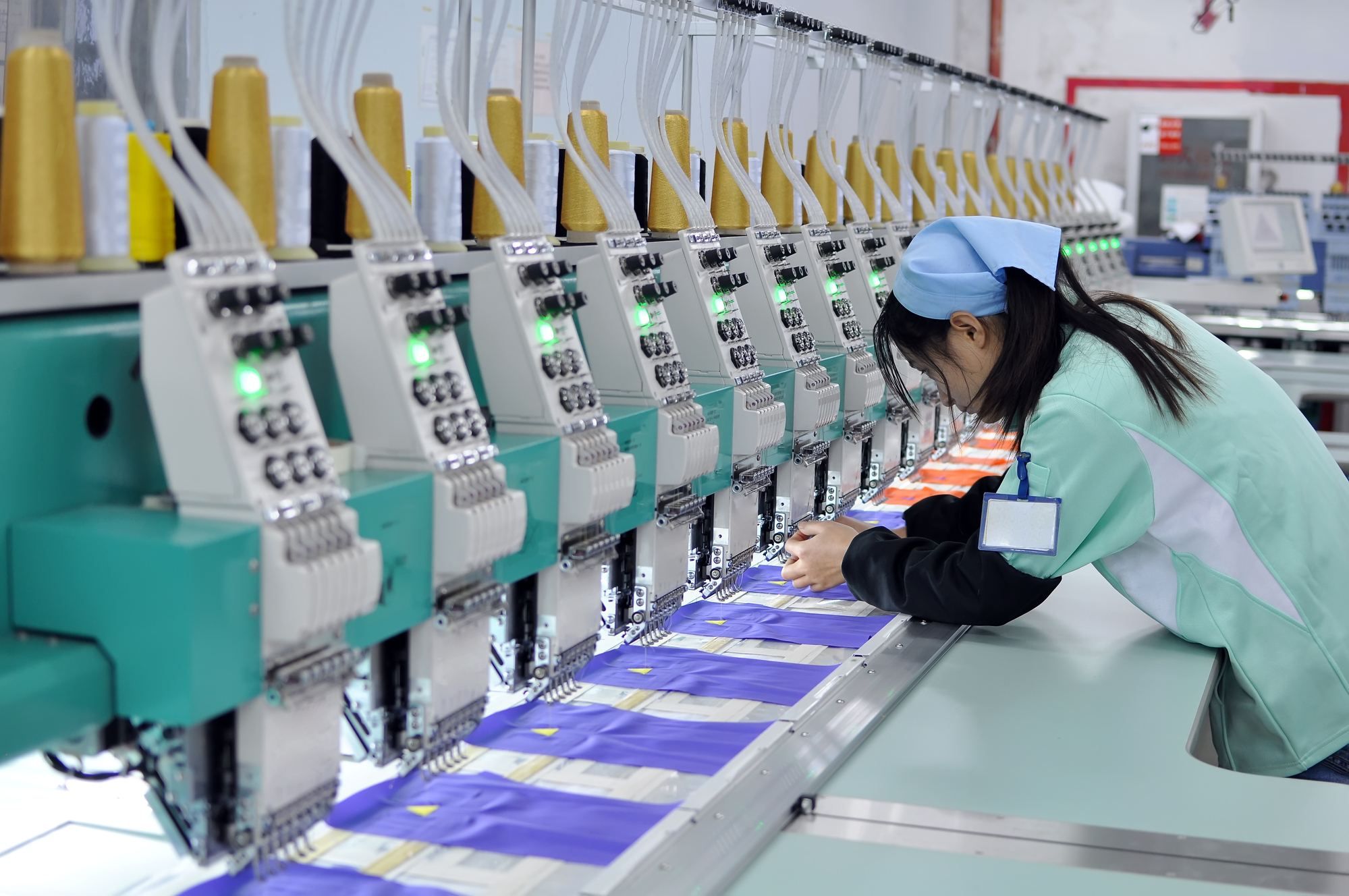 women working on production assembly line