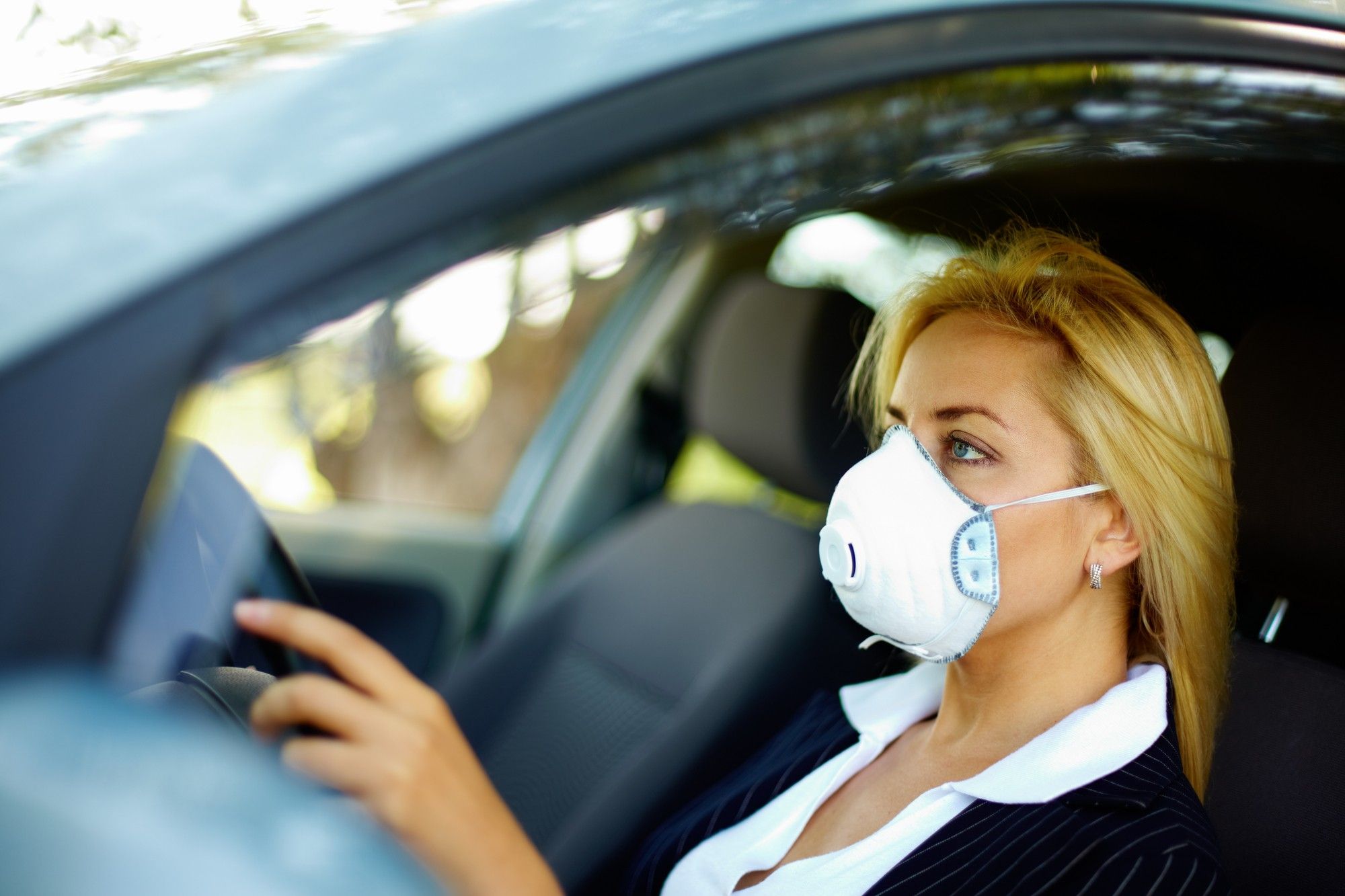 Female driver in face mask