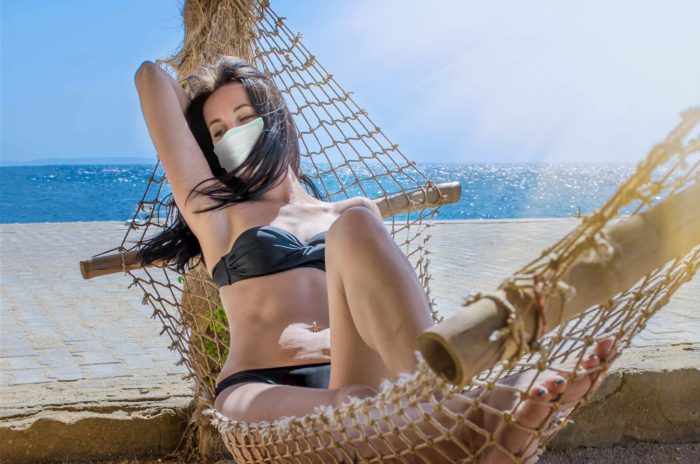 Florida resident wearing face mask on beach during coronavirus