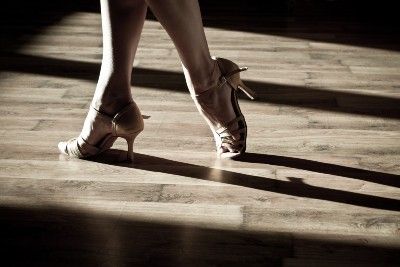 Woman's feet with high heels on ballroom dancing