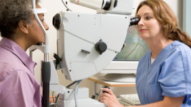 Female doctor provides eye exam to female patient