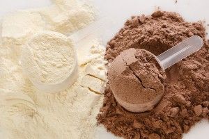 Two varieties of protein powder, with scoops