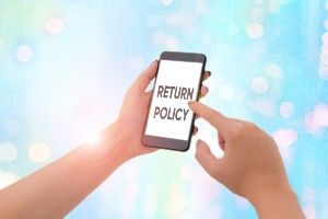 Graphic of person holding smartphone that reads "return policy"