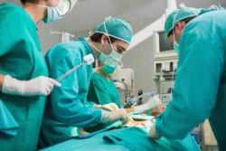 Surgeons operate on patient
